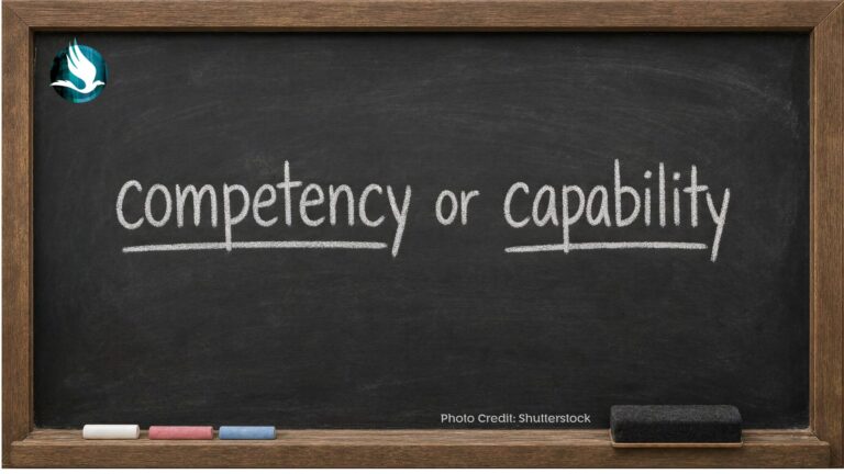 Black chalkboard with thunderbird logo in the top left and the words competency or capability underlined in white chalk on a black chalkboard
