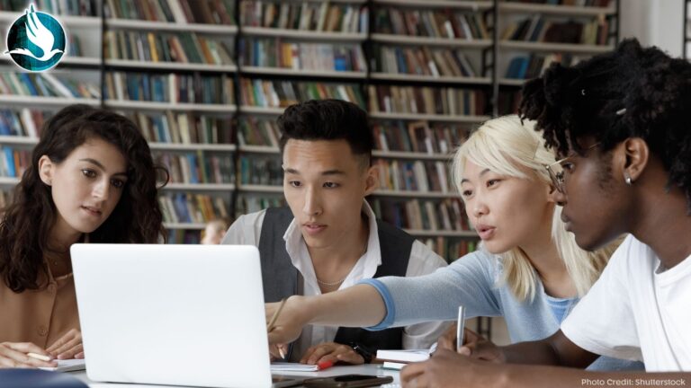 Group of higher educations students studying in a library