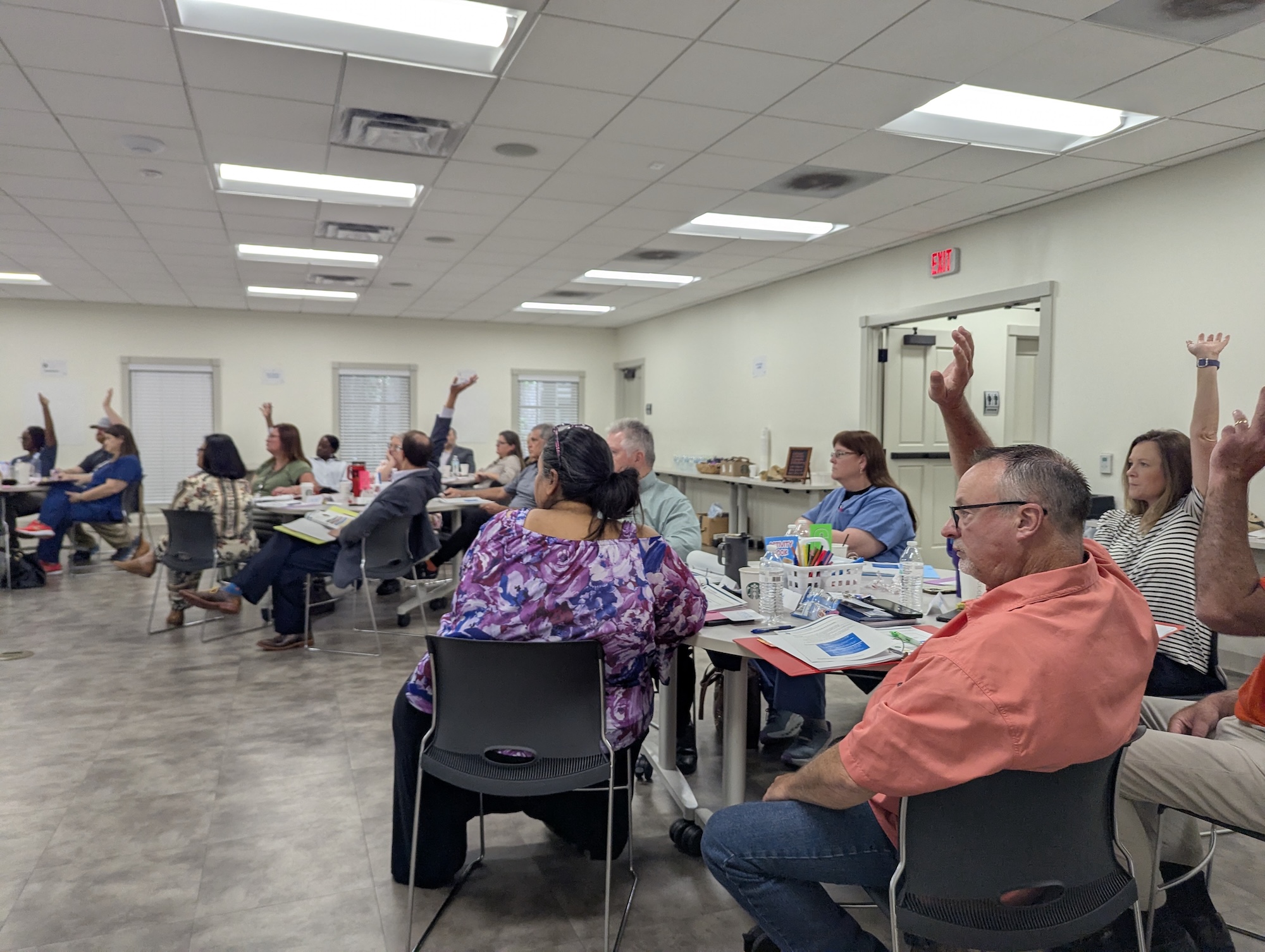 Thunderbird client teaming session with leaders engaged and hands raised.